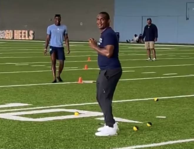 CB Dre Bly pitching during the Carolina Cookout wiffle ball game