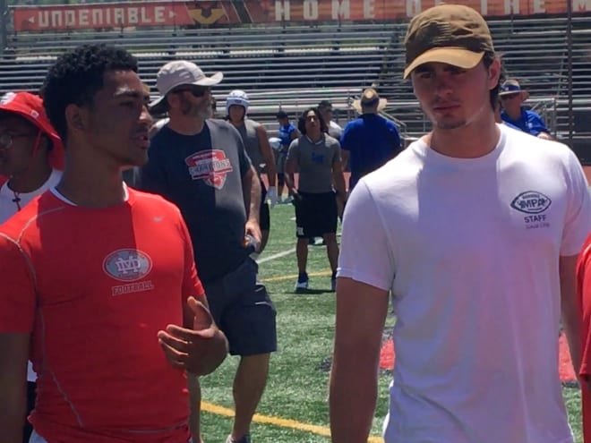 USC 2020 QB commit Bryce Young talks with USC starting QB and former Mater Dei HS standout JT Daniels on Saturday at the South County Passing Tournament.