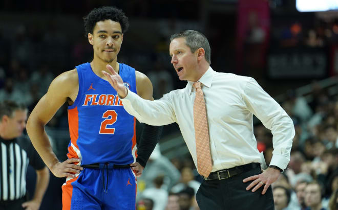 Florida coach Mike White (right) with former Gators point guard Andrew Nembhard.