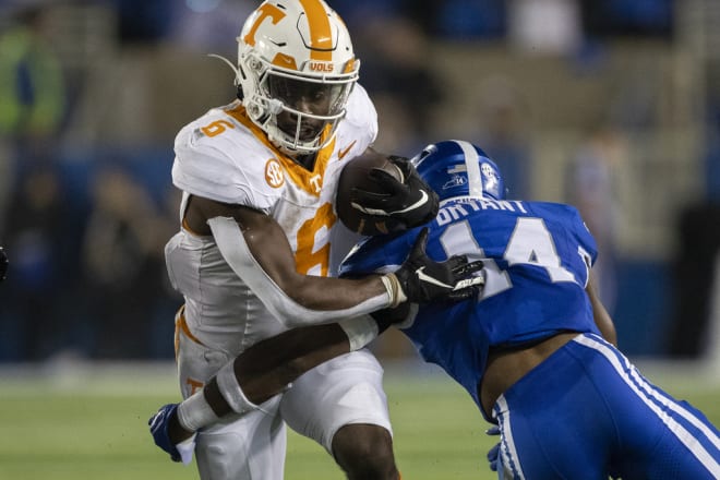 Tennessee running back Dylan Sampson (6) runs against Kentucky defensive back Ty Bryant (14) during the second half of an NCAA college football game in Lexington, Ky., Saturday, Oct. 28, 2023. (AP Photo/Michelle Haas Hutchins)