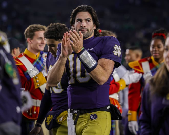 Notre Dame quarterback Sam Hartman (10) cheers on his Irish teammates during a 58-7 ND win over Pitt on Saturday.