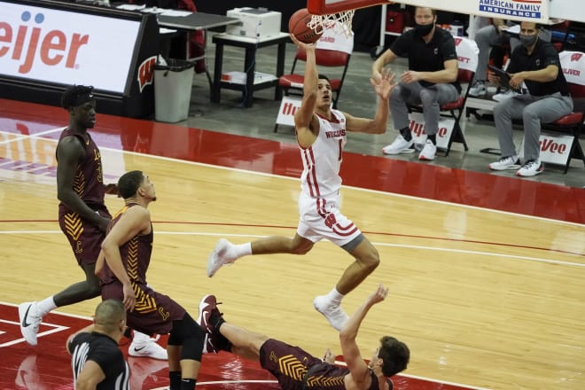 Wisconsin freshman Jonathan Davis draws the foul and coverts the basket during the Badgers' 77-63 victory over Loyola (Ill.)