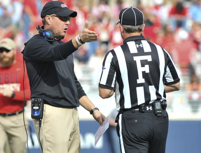 Ole Miss coach Hugh Freeze talks to the field judge Saturday during the Rebels' win over Georgia Southern