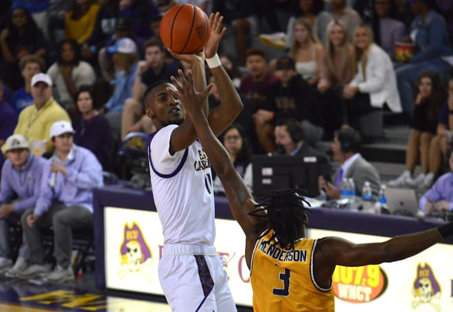 ECU's J.J. Miles launches in a jumper in the first half of the Pirates' win over Canisius Friday night.