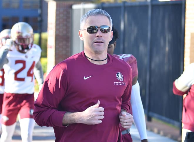 Mike Norvell jogs onto the Florida State football practice fields this week.