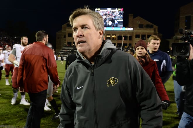 Colorado coach Mike MacIntyre leaves the field after the Buffaloes' win over Washington State Saturday in Boulder, Colo.