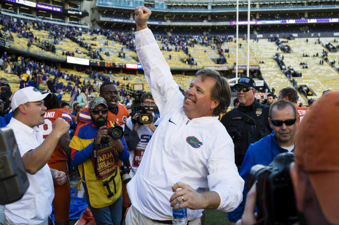 Florida coach Jim McElwain celebrates following the Gators' win at LSU Saturday, a victory that clinched the SEC East title.