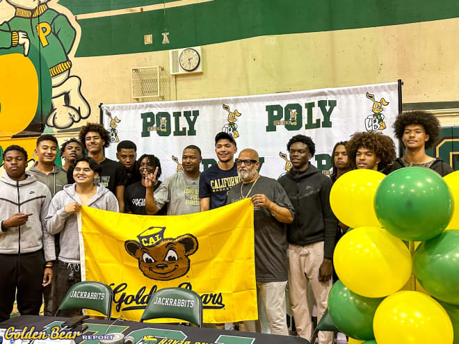 New Cal commit Jovani Ruff poses with his teammates holding a Bears flag after announcing his commitment to the program Wednesday.
