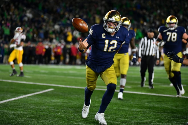 Notre Dame quarterback Ian Book celebrating after a touchdown that gave the Irish a 10-point lead against Rival USC(Andris Visockis)