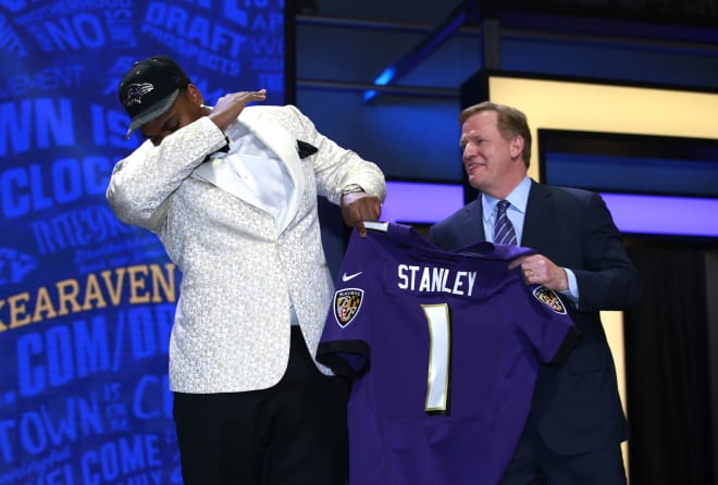 Former Notre Dame offensive tackle Ronnie Stanley dabs as NFL commissioner Roger Goodell looks on after Stanley was selected in the first round of the 2016 NFL Draft.