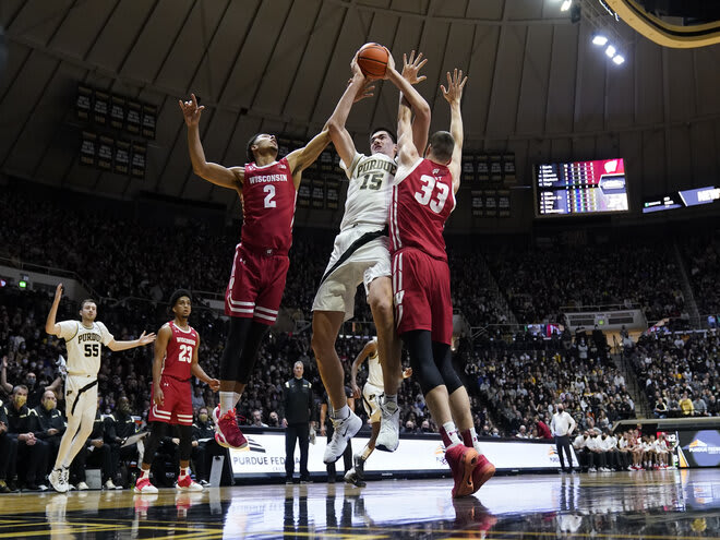 Purdue's Zach Edey (15) grabs a rebound against Wisconsin's Jordan Davis (2) and Chris Vogt (33) during the second half on Jan. 3, 2022.