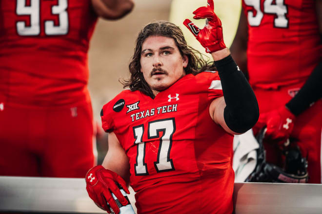 Colin Schooler celebrates on the sidelines during the Tech-Baylor game