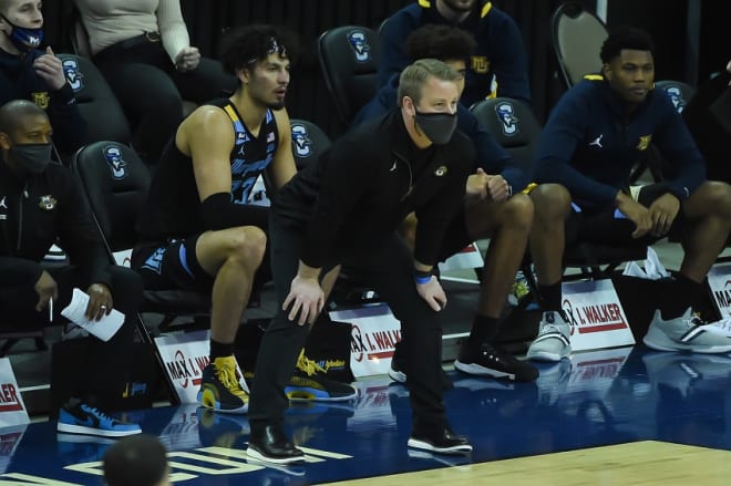 Former Duke player and assistant coach Steve Wojciechowski is playing UNC to benefit his team.