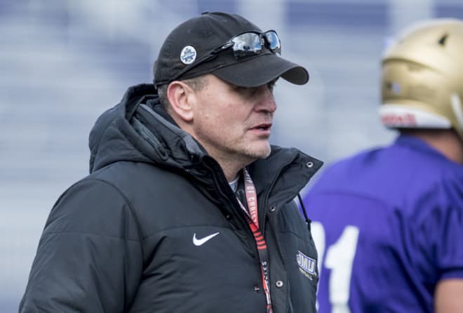 James Madison coach Mike Houston (shown in the spring) said his challenge is to keep the Dukes' recruiting class intact.