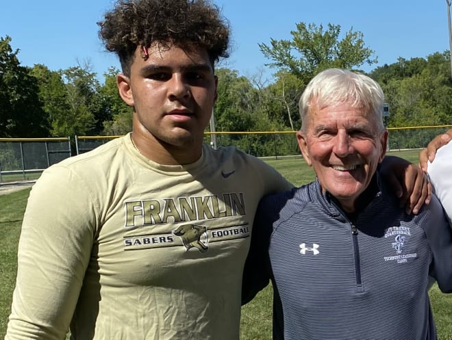 Wisconsin commit Myles Burkett and quarterbacks coach Jeff Trickey (right). 