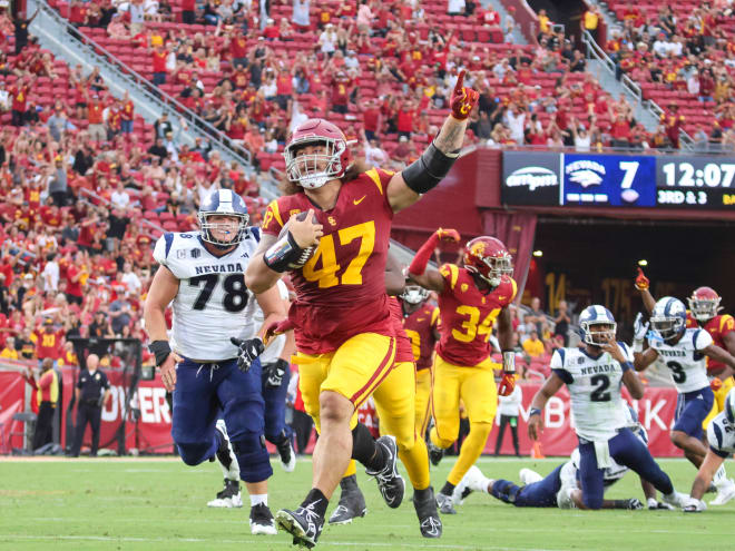 USC defensive lineman Stanley Ta'ufo'ou returns a fumble for a touchdown early in the fourth quarter.