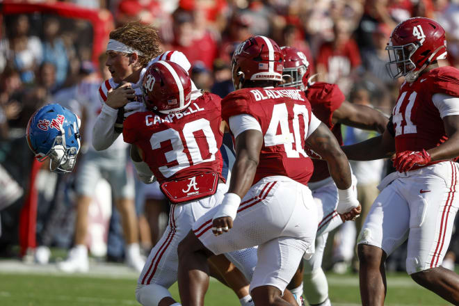 Mississippi Rebels quarterback Jaxson Dart (2) loses his helmet as he is hit by Alabama Crimson Tide linebacker Jihaad Campbell (30) during the first half at Bryant-Denny Stadium. Photo | Butch Dill-USA TODAY Sports