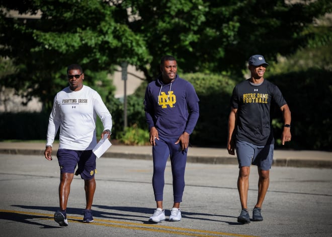 Notre Dame running backs coach Deland McCullough, left, cornerbacks coach Mike Mickens, middle, and wide receivers coach Chansi Stuckey are expected to be on the road recruiting Monday.