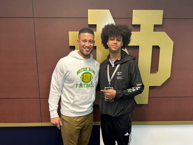 Four-star wide receiver Devin Carter, a 2026 recruit, poses with Notre Dame head coach Marcus Freeman (left).