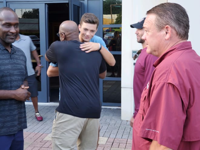 QB Kade Renfro is greeted by FSU's coaches when he returned to campus Sunday morning.