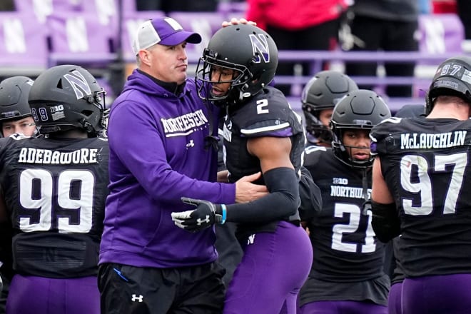 Pat Fitzgerald coaches Cam Mitchell during NU's 21-7 loss to Ohio State.