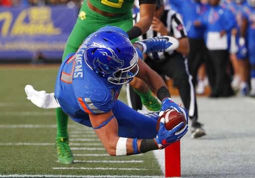 Boise State tight end Alec Dhaenens dives into the end zone for a touchdown against Oregon during the second half of the Las Vegas Bowl NCAA college football game Saturday, Dec. 16, 2017, in Las Vegas.