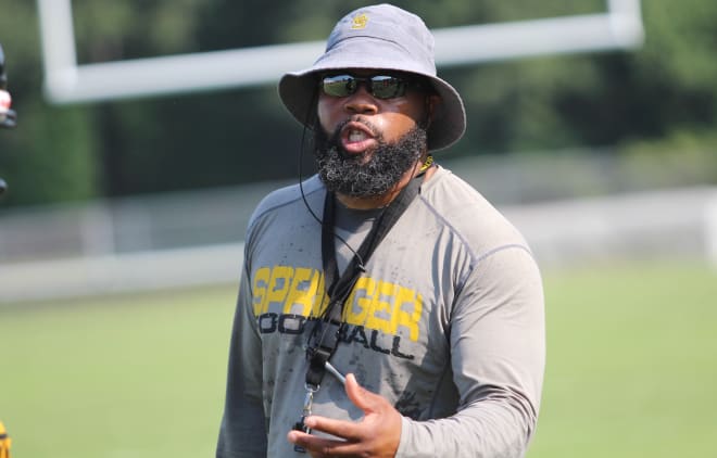 Highland Springs Head Coach Loren Johnson coaches his team up during their scrimmage against Thomas Dale in August.