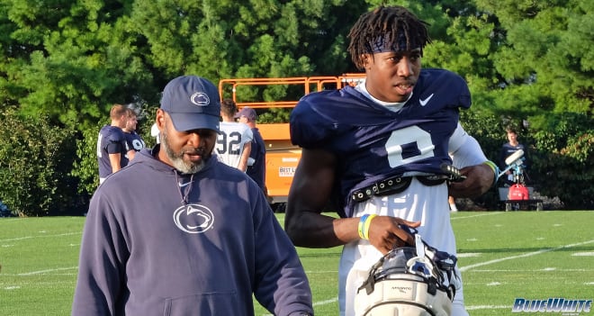 Terry Smith and Joey Porter Jr. walk off the field together following a practice during the Nittany Lions' 2019 season.