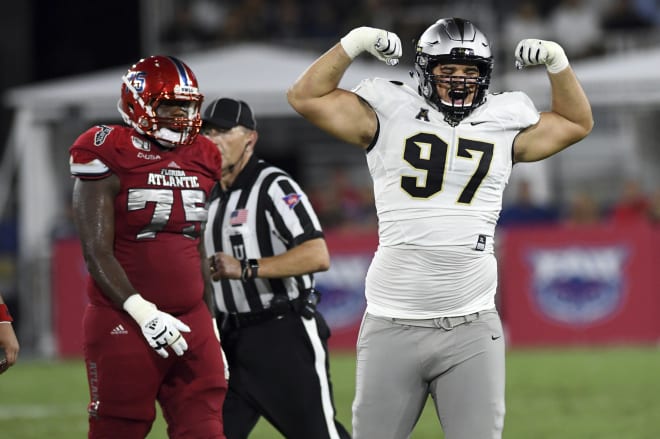 Central Florida defensive lineman Mason Cholewa celebrates after making a tackle for loss in the Knights' win over Florida Atlantic last year in Boca Raton, Fla. 