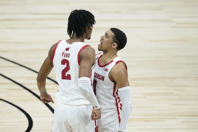 Wisconsin's Aleem Ford (2) celebrates with D'Mitrik Trice (0) after Ford hit a shot as time expired to end the first half to put UW up 41-31.