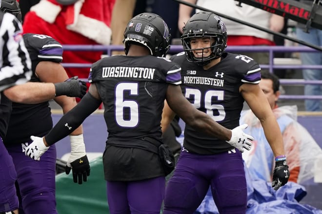 Evan Hull celebrates his touchdown with Malik Washington.