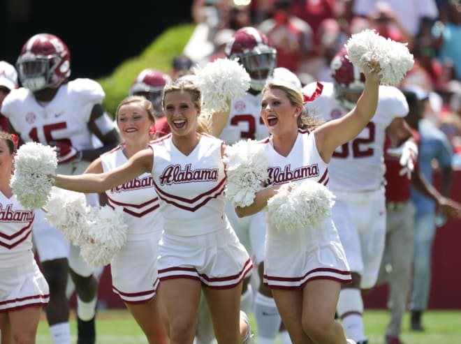 Alabama cheerleaders re-enact the A-Day Running of the Gumps. 