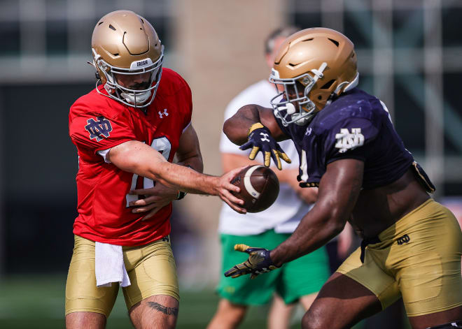 Players get set on the line of scrimmage during the second half of