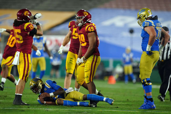 Freshman defensive end Tuli Tuipulotu (No. 49) had a big sack vs. UCLA on Saturday.