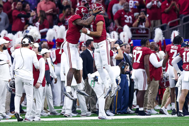 Alabama Crimson Tide quarterback Jalen Milroe (4) and quarterback Bryce Young (9) celebrate during the first half in the 2022 Sugar Bowl at Caesars Superdome. Photo | Stephen Lew-USA TODAY Sports