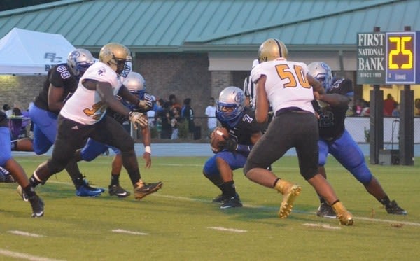 Lawson (50) can play either defensive tackle or defensive end at the high school level.