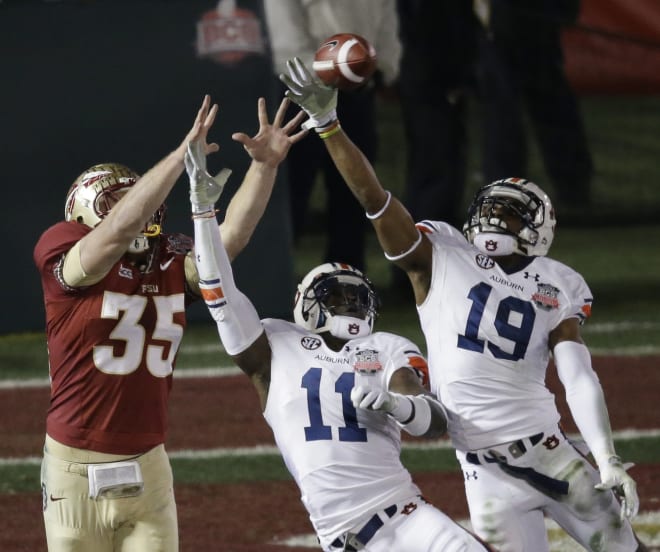 White (19) and Chris Davis break up a pass in the 2013 BCS National Championship Game.