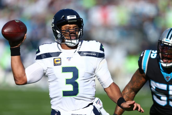Former NC State quarterback Russell Wilson and the Seattle Seahawks won 30-24 at the Carolina Panthers on Sunday.