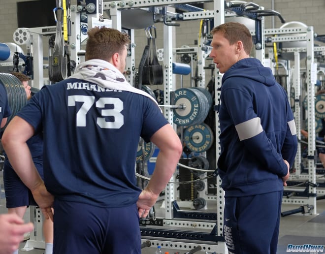 Phil Trautwein and Mike Miranda chat during a lifting session at the Lasch Building.