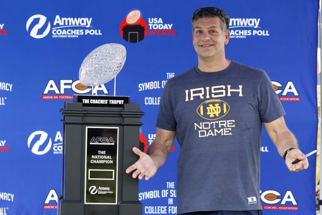 ESPN Radio host and former Irish defensive lineman Mike Golic Sr. with the 2018 national championship trophy