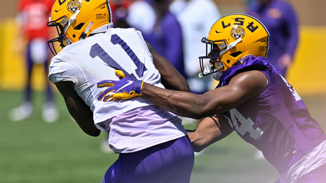 Oklahoma State transfer Jarrick Bernard-Converse (purple jersey No. 14) is expected to start at cornerback for LSU despite missing most of the spring with a foot injury.