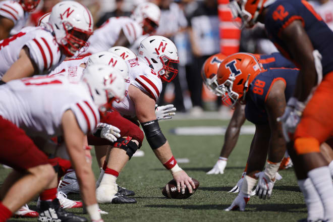  Nebraska Cornhuskers and Illinois Fighting Illini players face off at the line of scrimmage during a college football game on August 28, 2021 at Memorial Stadium in Champaign, Illinois. 