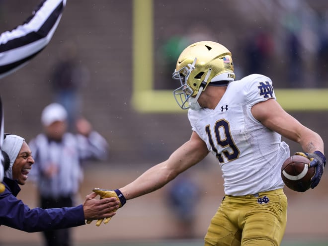 Notre Dame freshman wide receiver Jaden Greathouse, right, made wide receivers coach Chansi Stuckey, left, look prescient in Saturday's Blue-Gold Game.