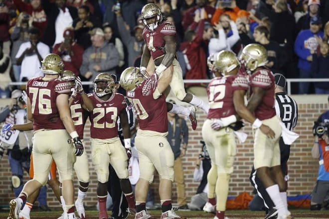 Florida State celebrates a Dalvin Cook touchdown in a win over rival Florida on Saturday at Doak Campbell Stadium.