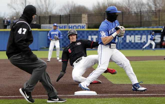 Georgia's Corey Collins slid into third base as Kentucky's Chase Estep turned an unassisted double play in Friday's SEC series opener at Kentucky Proud Park.