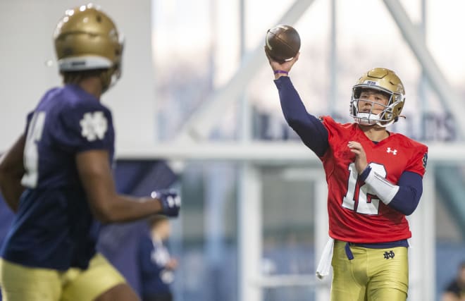 Tyler Buchner (right) will not play in Saturday's Blue-Gold Game.