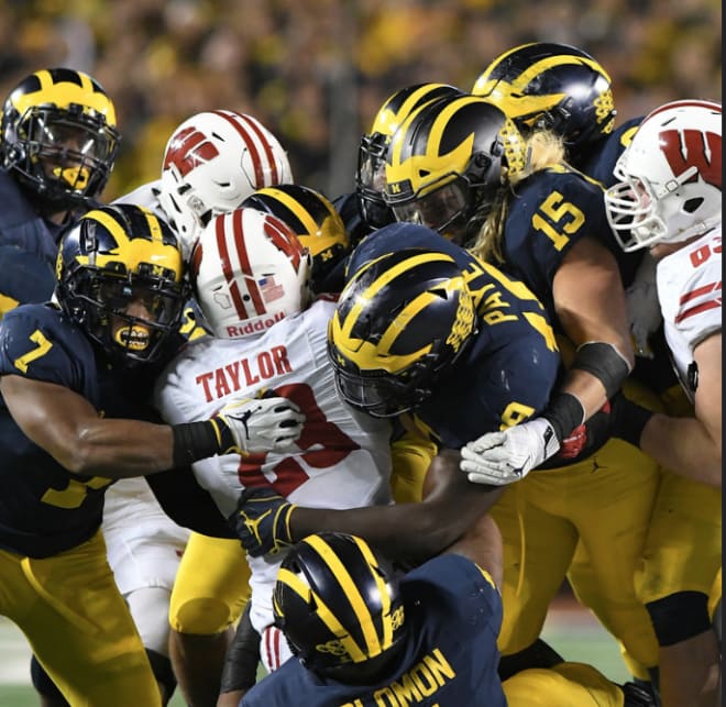 Michigan's defense will need a team effort like last year's to upend Wisconsin in Madison. 