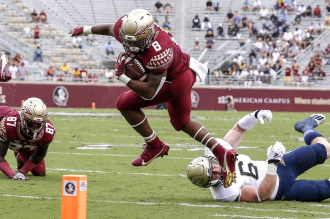 FSU running back La'Damian Webb tries to avoid a defender during the season opener against Georgia Tech.