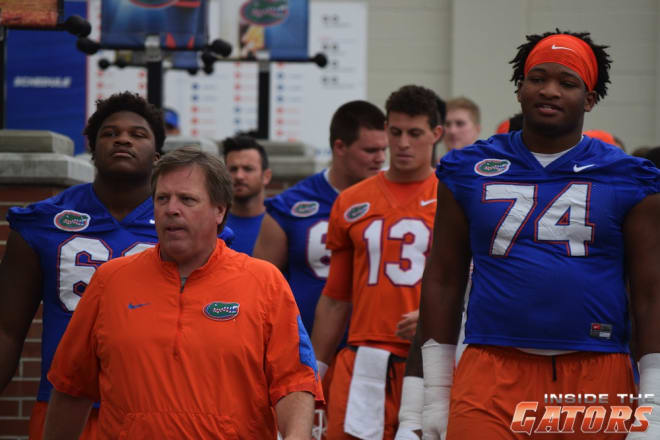 Florida head coach Jim McElwain leads his team into practice