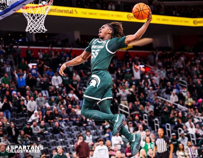 Michigan State's Coen Carr slams down a monster dunk during the first half against Baylor in Detroit on Dec. 16, 2023.